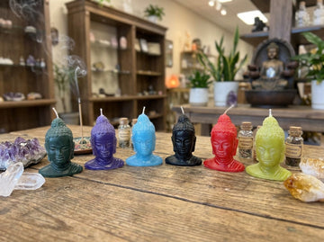 Vela con cabeza de Buda