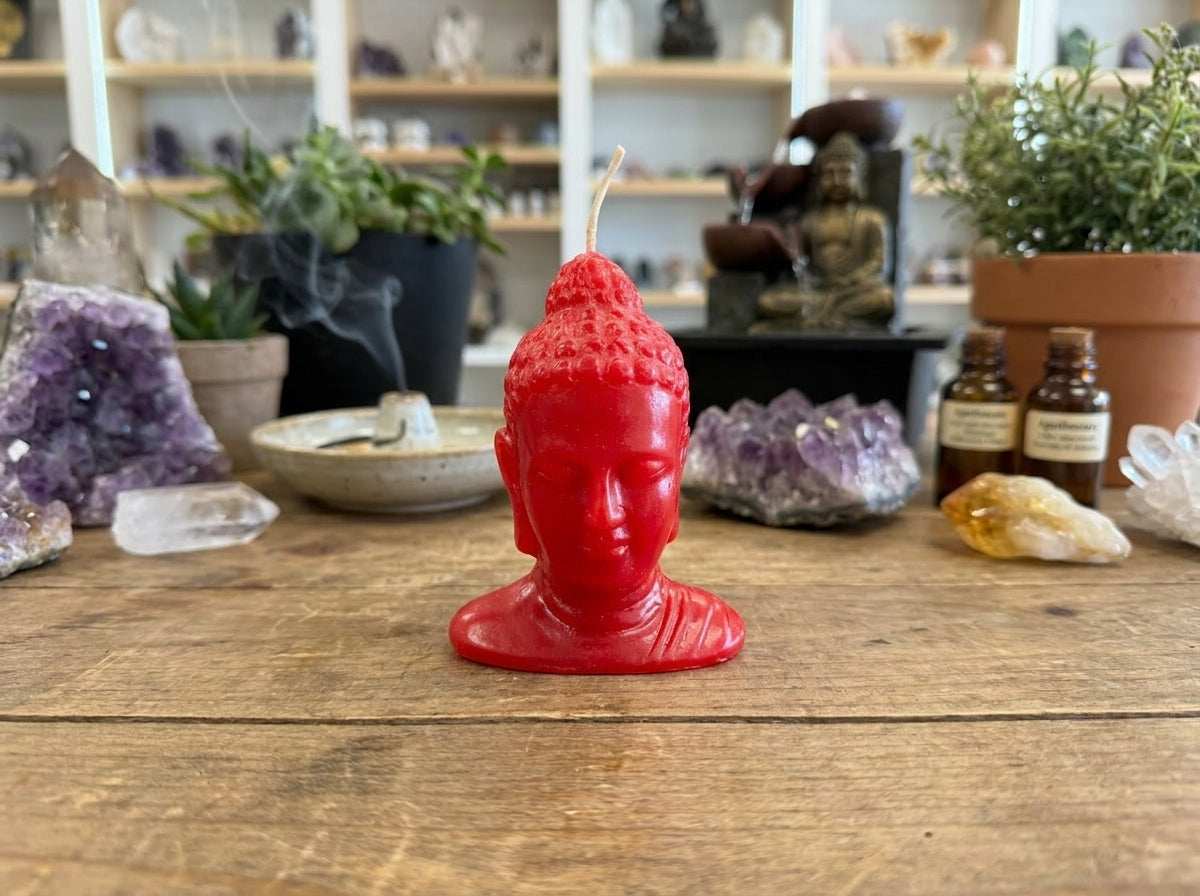 Vela con cabeza de Buda