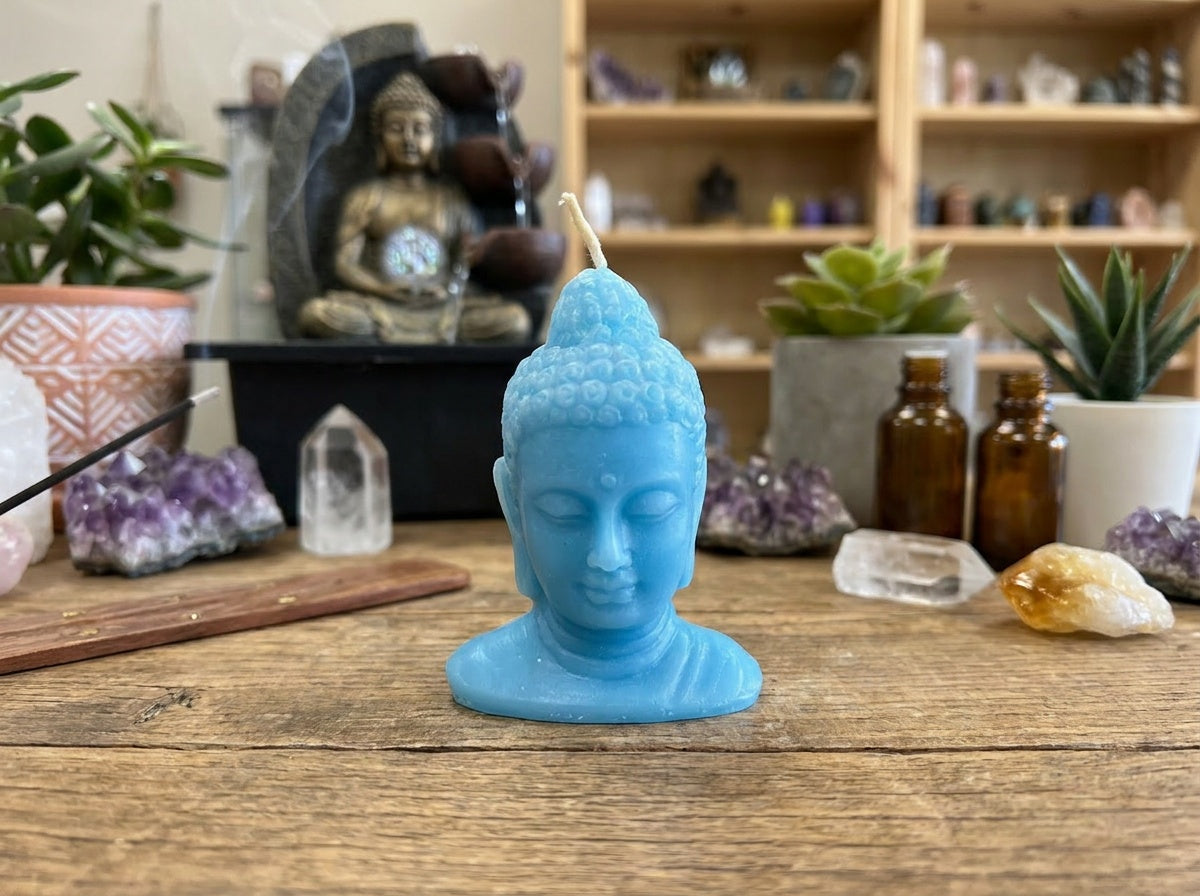 Vela con cabeza de Buda