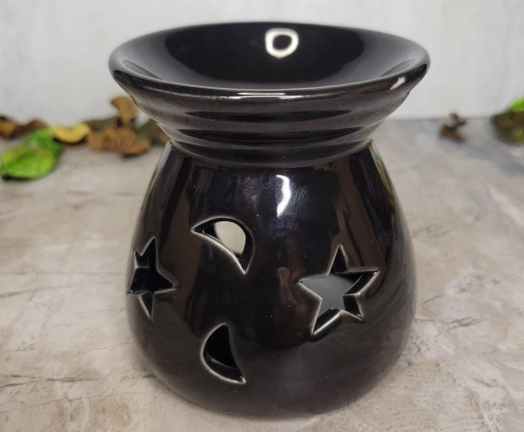 Quemador de aceite cerámico con forma de luna y estrellas